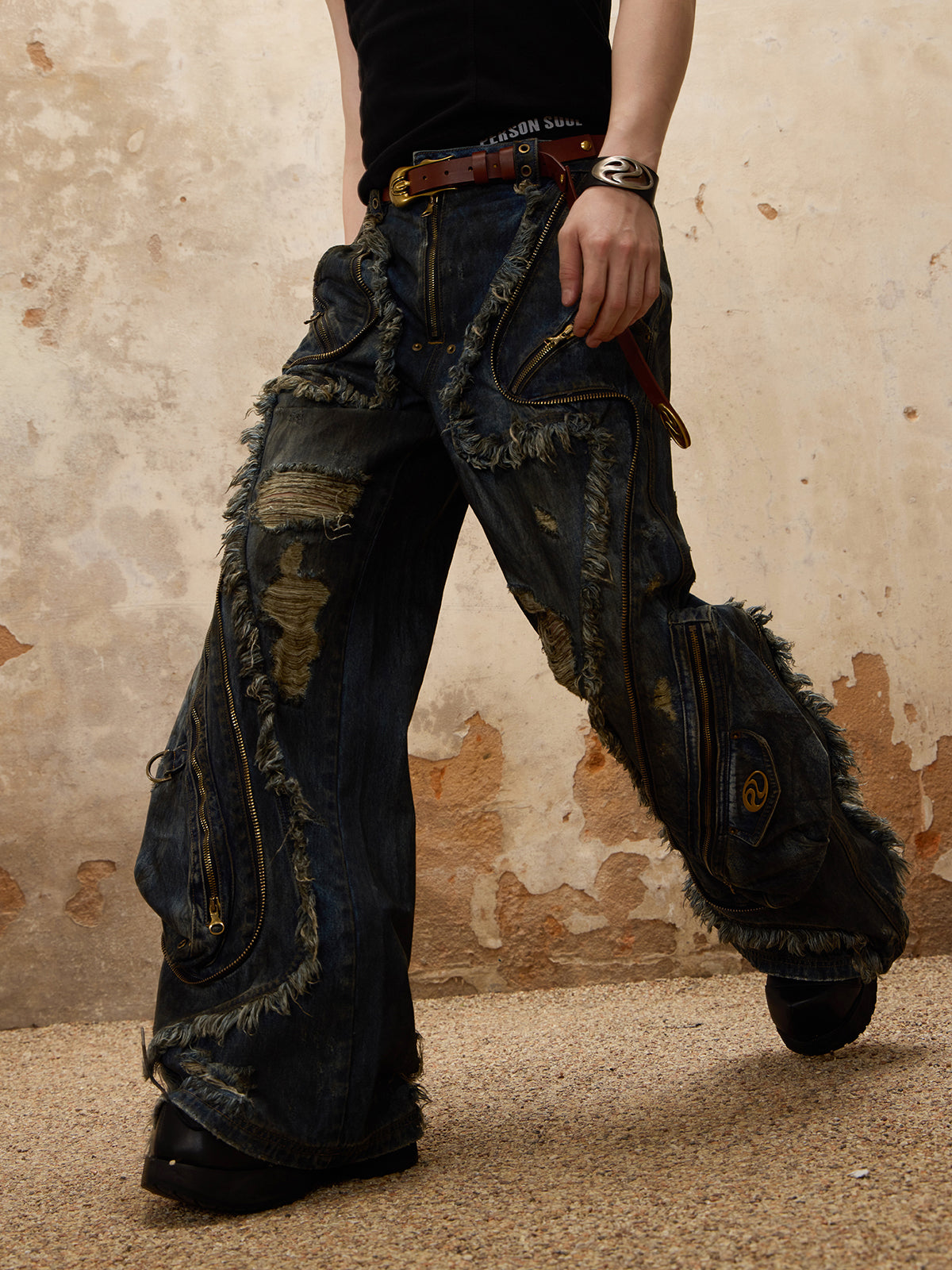 The Alien Dirty Denim Jeans feature a unique frayed design, unisex distressed detailing, and a modern, relaxed fit.